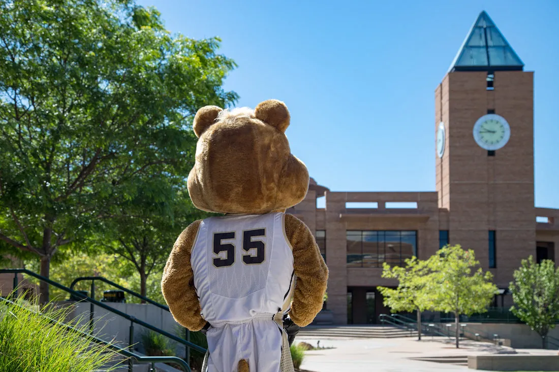 clyde standing in front of the clock tower